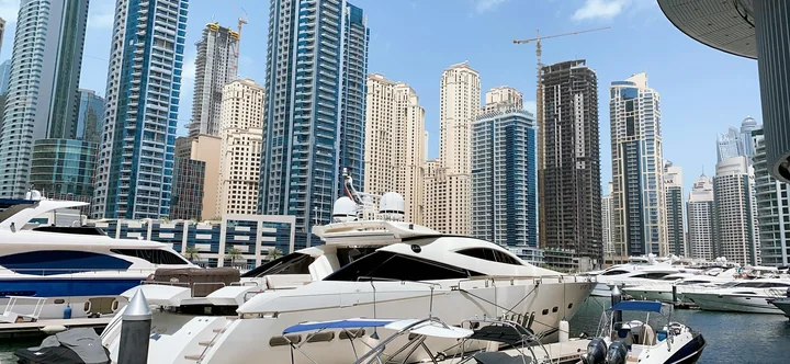 Yachts and waterfront towers at Dubai Marina, shown as a destination reference